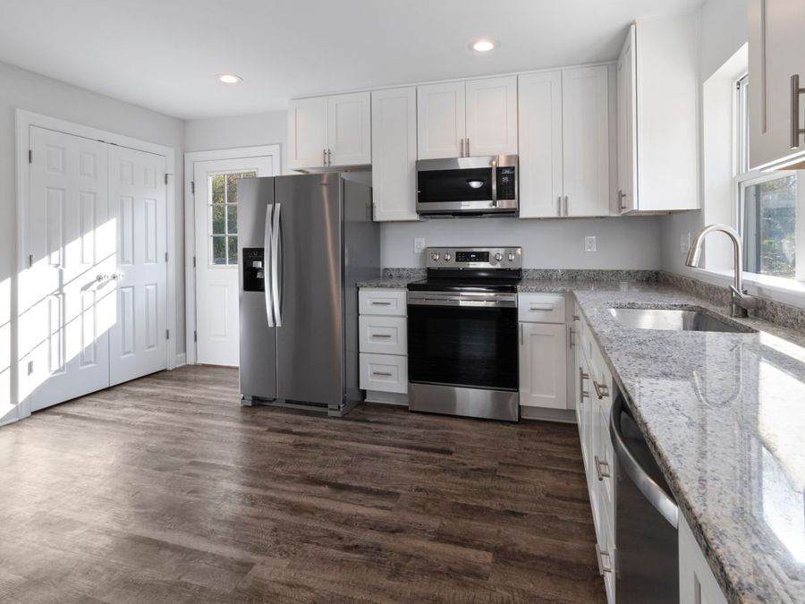 A finished kitchen remodel — new cabinets, counters and flooring